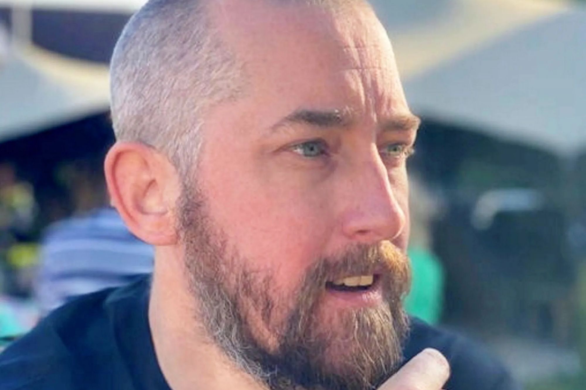 An image collage containing 1 images, Image 1 shows PC Mathew Parker, a bearded man, looks away from the camera