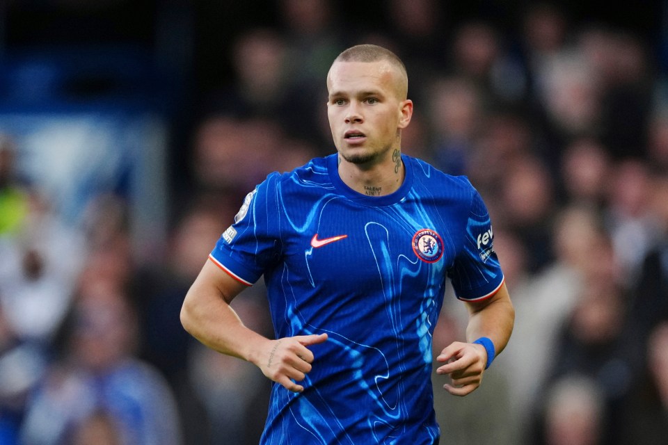 Mykhailo Mudryk in a blue Chelsea jersey.
