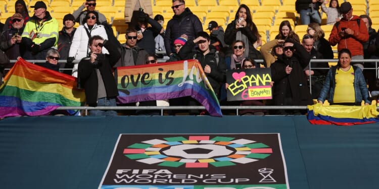 International soccer fans hold pride flags at the FIFA Women's World Cup Australia and New Zealand 2023 Quarter Final match on Aug. 11, 2023 in Wellington, New Zealand.