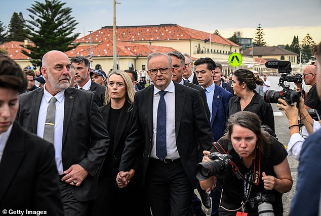 Police will allege the threat against the Prime Minister (pictured in Bondi) was made on December 19