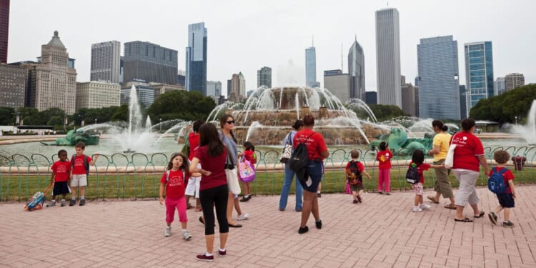 A group of preschool children walk around Buckingham Fountain in Grant Park in downtown Chicago on July 22, 2010.