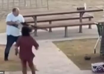 Israeli national Gefen Bitton (in red)  is seen running to help bystander Ahmed Al-Ahmed after he disarmed one of the alleged gunmen