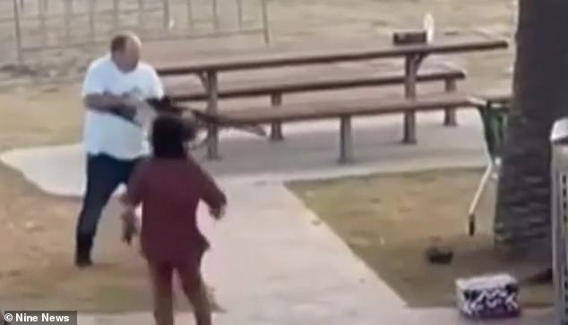 Israeli national Gefen Bitton (in red)  is seen running to help bystander Ahmed Al-Ahmed after he disarmed one of the alleged gunmen