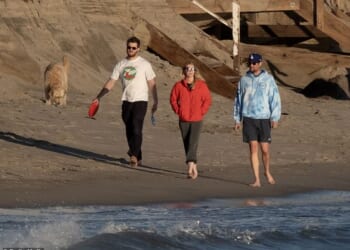 Rob Reiner's son Jake, pictured far R, enjoyed a soothing sunset beach walk with his girlfriend Maria Gilfillan and his sister Romy's boyfriend, Alex Silberberg, in Southern California on Sunday