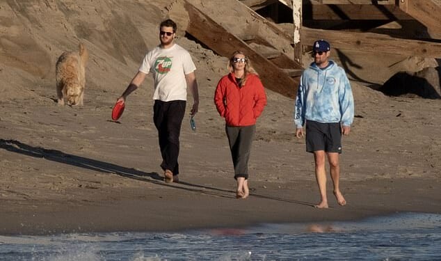 Rob Reiner's son Jake, pictured far R, enjoyed a soothing sunset beach walk with his girlfriend Maria Gilfillan and his sister Romy's boyfriend, Alex Silberberg, in Southern California on Sunday
