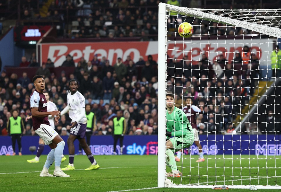 Aston Villa's Morgan Rogers scores their first goal past Manchester United's Senne Lammens.