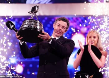 Rory McIlroy lifts the SPOTY gong, presented to him by 2024 winner Keely Hodgkinson