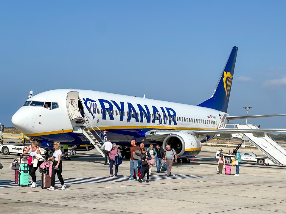 Boeing 737-800 aircraft, used by Ryanair, at Paphos Airport. Passengers disembark