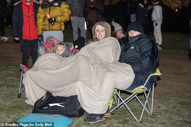 Londoners welcome in the New Year by watching the firework display from Parliament Hill