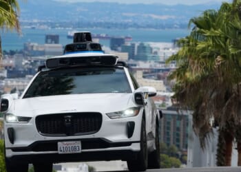 A Waymo car drives up a hill in San Francisco on Sept. 4, 2025.