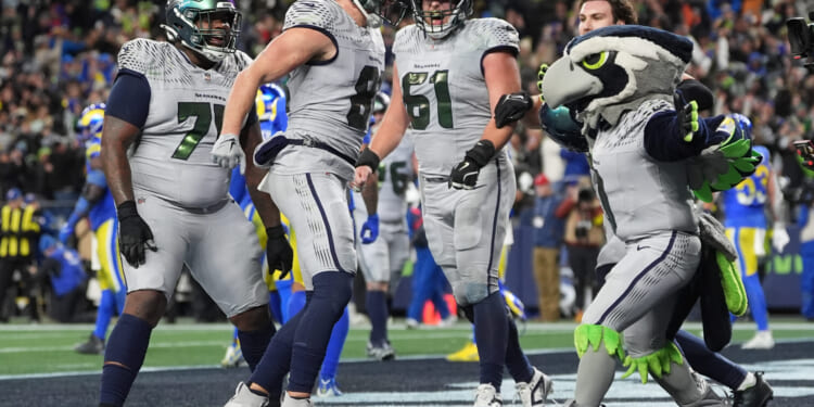 Seattle Seahawks tight end Eric Saubert celebrates after successfully scoring a two-point conversion in the overtime of a contest against the Los Angeles Rams on Dec. 18, 2025 in Seattle.