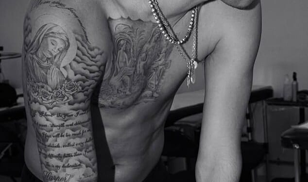 Romeo Beckham has shared a new photo showing off his extensive tattoo collection as he appears to steer clear of ongoing family drama involving his brother Brooklyn