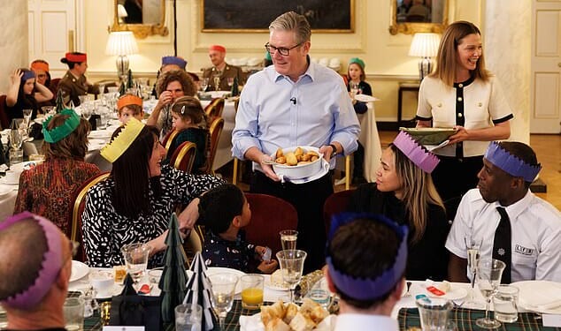 After a chaotic year and with the threat of a Labour coup rising, the PM used his festive address to insist his 'priority' is making life easier in Britain (pictured hosting a reception for front line public service workers in No10 this week)