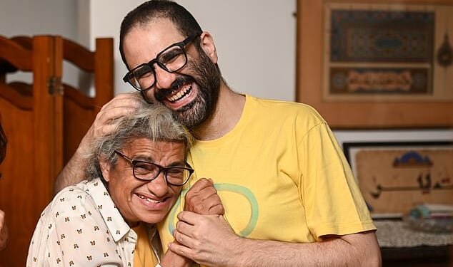 Alaa Abd El-Fattah with his mother Laila after arriving back in the UK