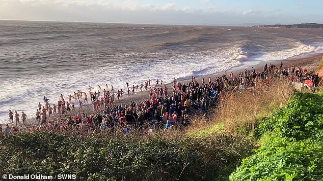 Moments after this photograph was taken on Christmas Day swimmers ran into difficulty and two men disappeared into the waves at Budleigh Salterton in Devon