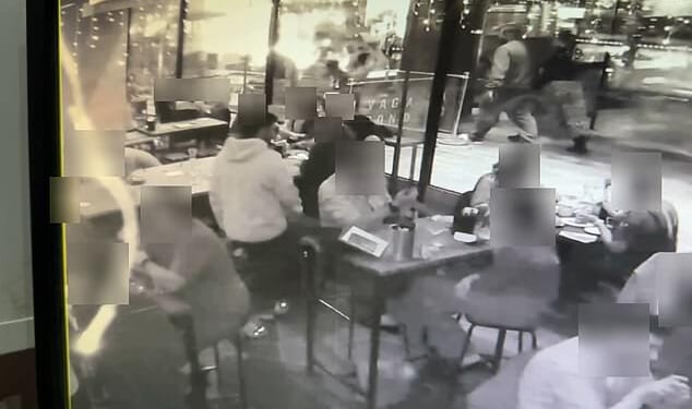 This is the moment prolific Algerian laptop snatcher Munir Ghilas, pictured standing in a white hoodie, brazenly swipes a drinker's bag in a London pub during a summer stealing spree
