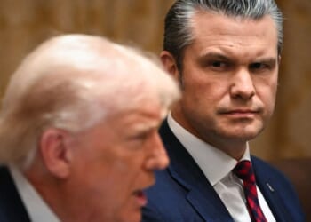 President Donald Trump speaks alongside Secretary of War Pete Hegseth during a Cabinet meeting in the White House in Washington, D.C., on Dec. 2, 2025.