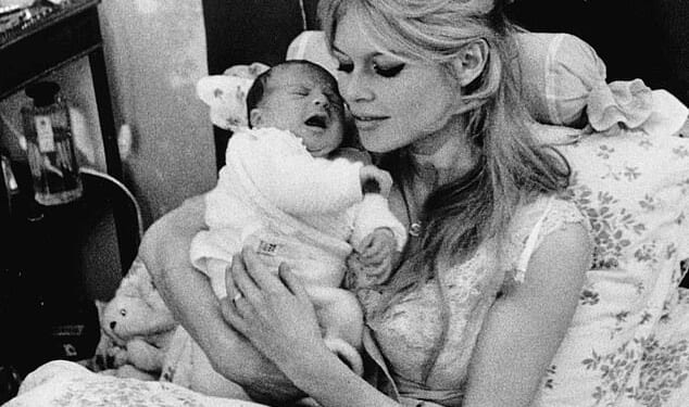 Brigitte Bardot made her estranged son Nicolas-Jacques Charrier a promise before her death after admitting she'd rather 'give birth to a dog' (pictured with her son in 1960)