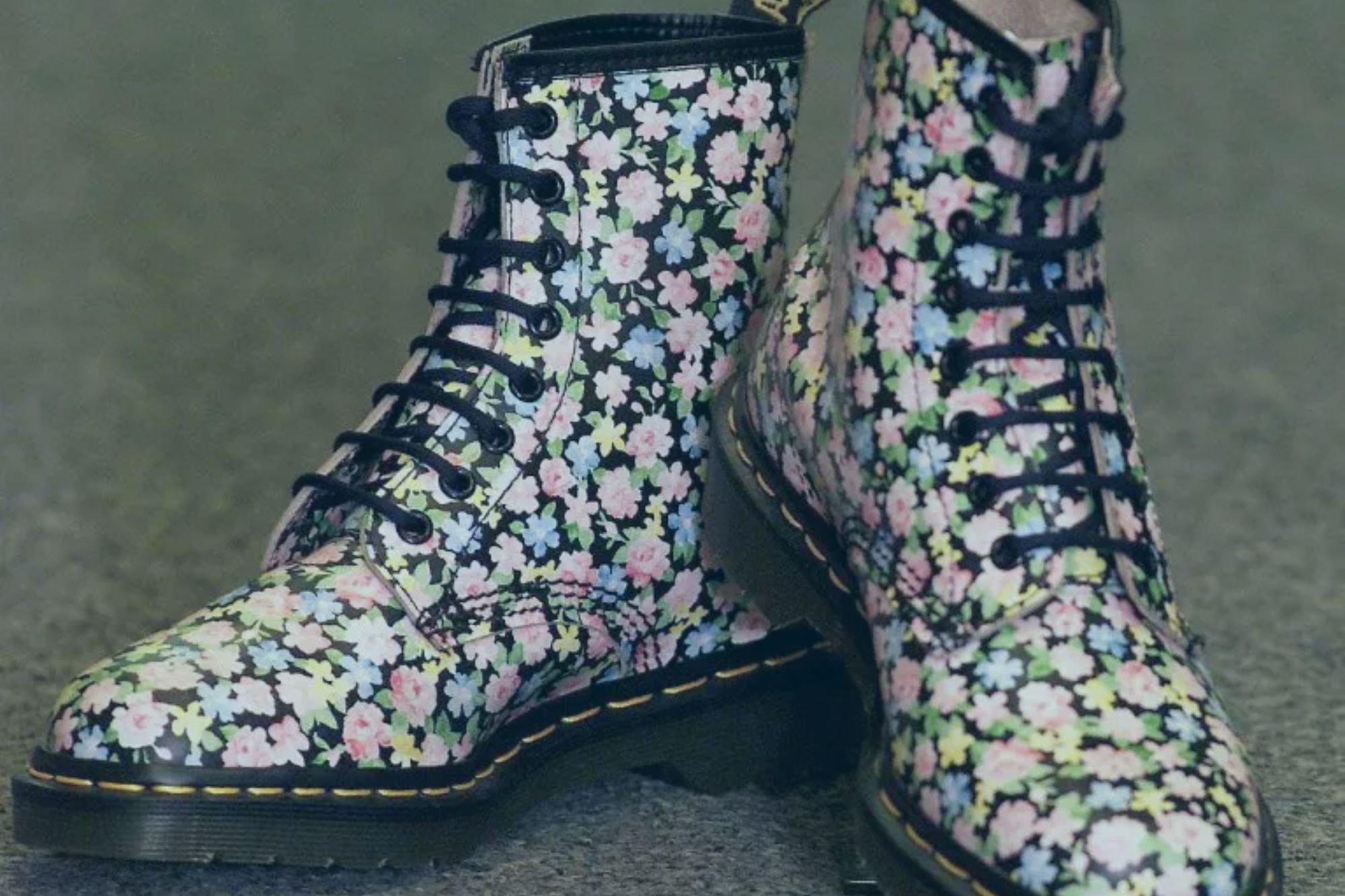 An image collage containing 1 images, Image 1 shows Pair of Dr. Martens boots with a floral pattern
