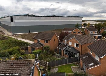 Aerial images show the effects of the 'monstrous' warehouses on neighbours, where cladding installed is now blocking light and creating darkness