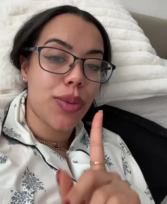 A woman in glasses wearing a patterned top says, "Vinted Unwanted Gifts!!"