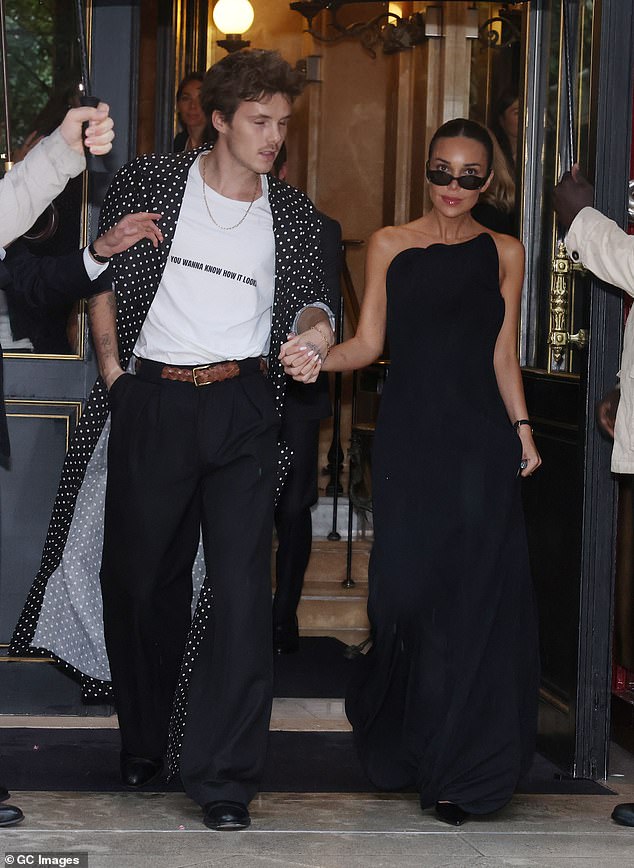The pair leave their hotel ahead of the Victoria Beckham fashion show at Paris Fashion Week in October