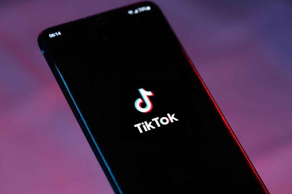 a phone with the tiktok logo on the screen