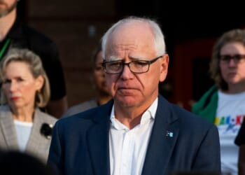 Minnesota Gov. Tim Walz speaks to media outside Deerwood Elementary in Eagan, Minnesota, on Sept. 2, 2025.