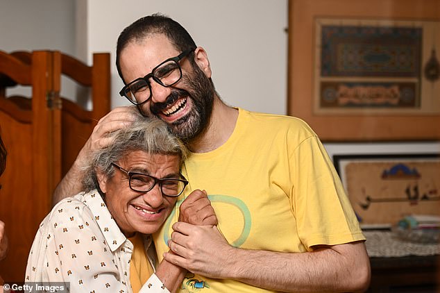 Alaa Abd El-Fattah (right) is reunited with his mother Laila (left) in Cairo after his release from prison in September 2025