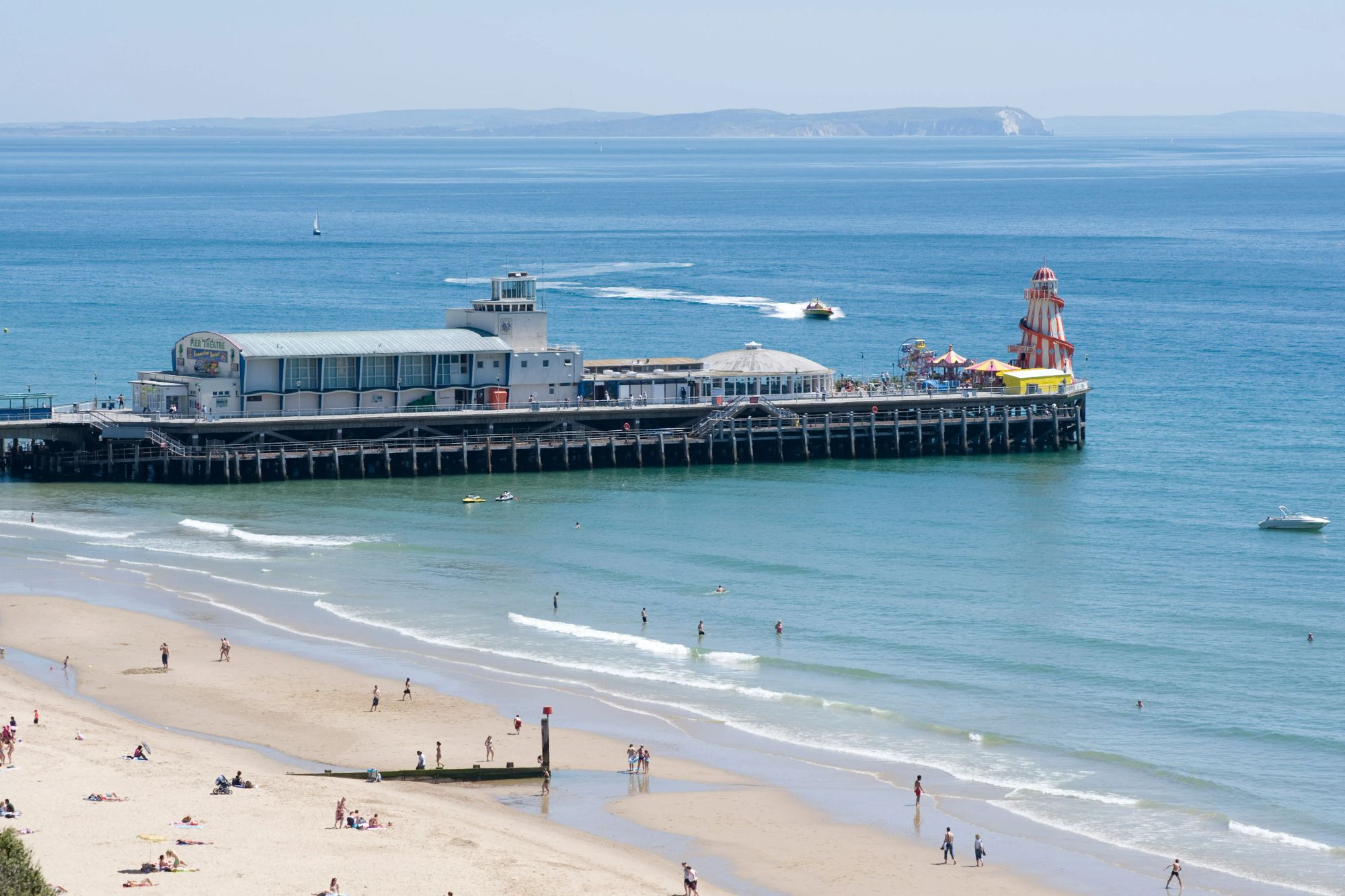 An image collage containing 1 images, Image 1 shows Bournemouth Beach and Pier in Dorset, UK