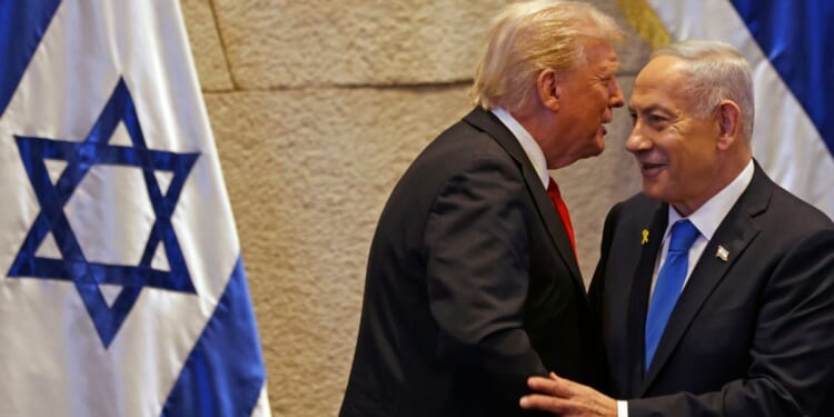 President Donald Trump speaks with Israel's Prime Minister Benjamin Netanyahu in the Knesset, Israel's parliament, in a file photo from Oct. 13.