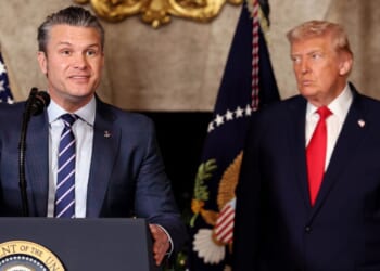 Secretary of War Pete Hegseth speaks alongside President Donald Trump as Trump announced the creation of the “Trump-class” battleship during a statement to the media at Trump’s Mar-a-Lago estate on Dec. 22, 2025, in Palm Beach, Florida.