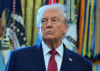 President Donald Trump listens during a ceremony in the Oval Office of the White House in Washington, DC on Dec. 15, 2025.