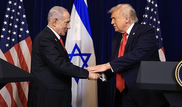 U.S. President Donald Trump shakes hands with Israeli Prime Minister Benjamin Netanyahu during a press conference at his Mar-a-Lago after being informed he will be awarded the Israel Prize
