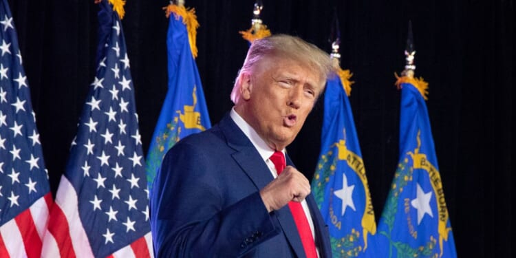 President Donald Trump pumps his fist at an event in Fervent Calvary Chapel Church in Las Vegas on July 8, 2023.