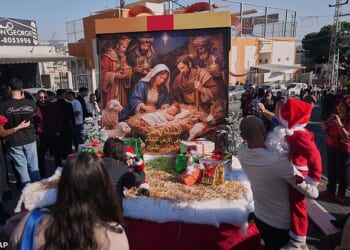 Christians celebrate the 40th annual Christmas parade heading towards the Basilica of the Annunciation in Nazareth, Israel, Wednesday, Dec 24, 2025