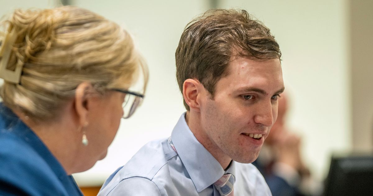 Tyler Robinson, the man accused of murdering conservative Charlie Kirk, shows a smile during a hearing in Provo, Utah, on Dec. 11, 2025.