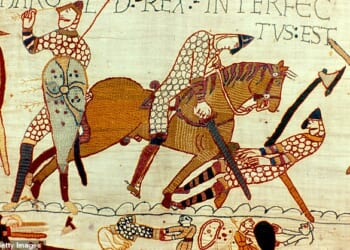 Part of the tapestry is the battle of Hastings, the death of Harold II last Anglo-Saxon king of England. Left, figure pulling arrow from eye and then being cut down by Norman knight. Armour Chain Mail Sword Axe Textile (October 1066)