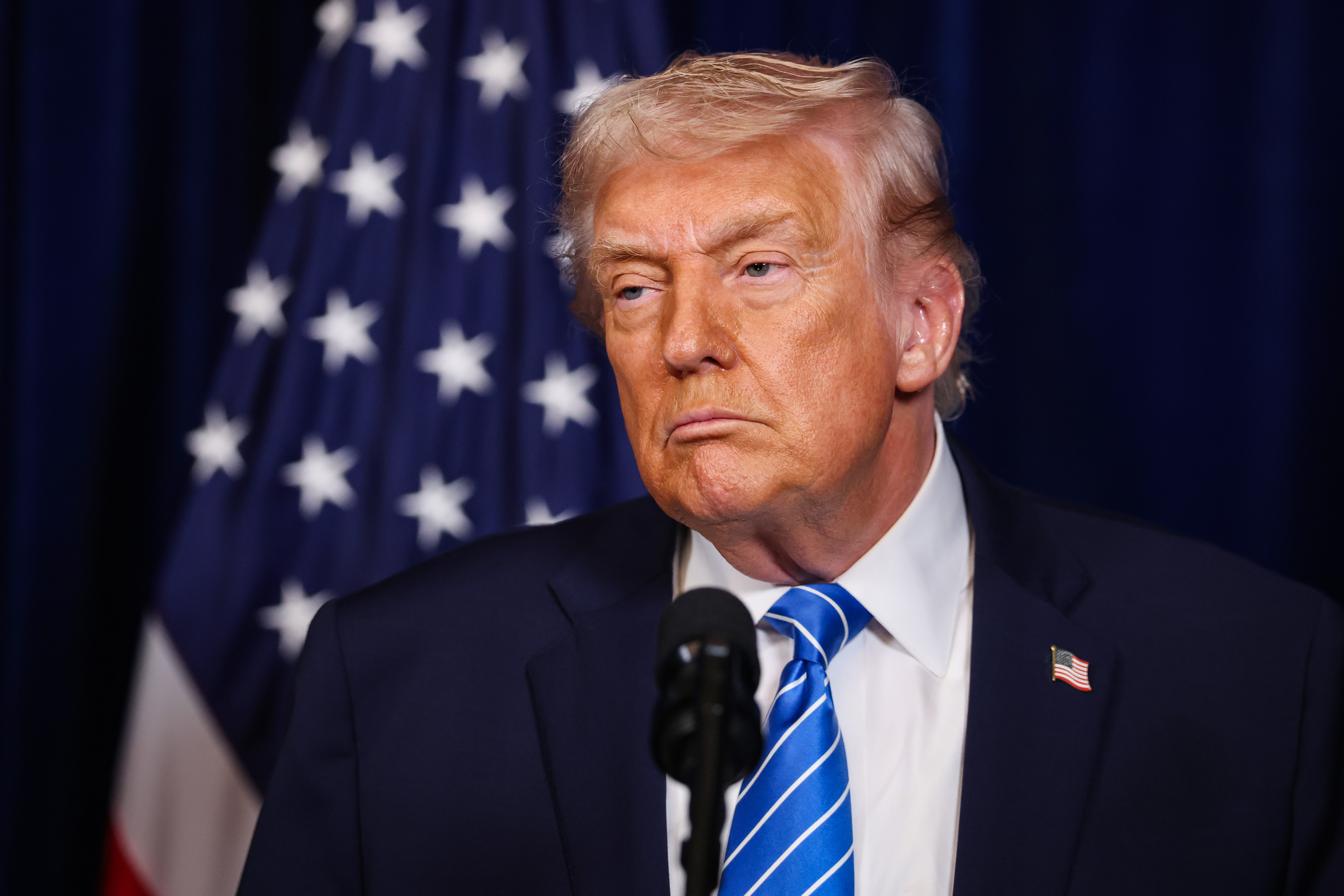 President Donald Trump listens during a press conference with Ukrainian President Volodymyr Zelensky.