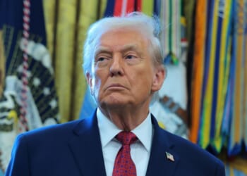 President Donald Trump listens during a ceremony for the presentation of the Mexican Border Defense Medal in the Oval Office of the White House on Dec. 15, 2025, in Washington, D.C.
