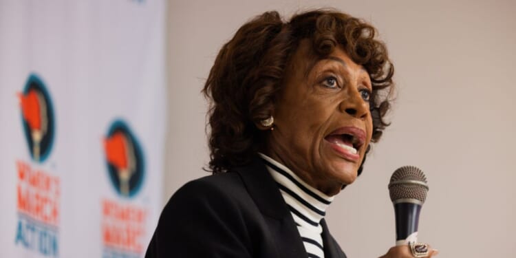 Rep. Maxine Waters speaks to a crowd of volunteers before a phone banking event for Prop 50 at the Women's March Foundation Office on Oct. 23, 2025, in Los Angeles, California.