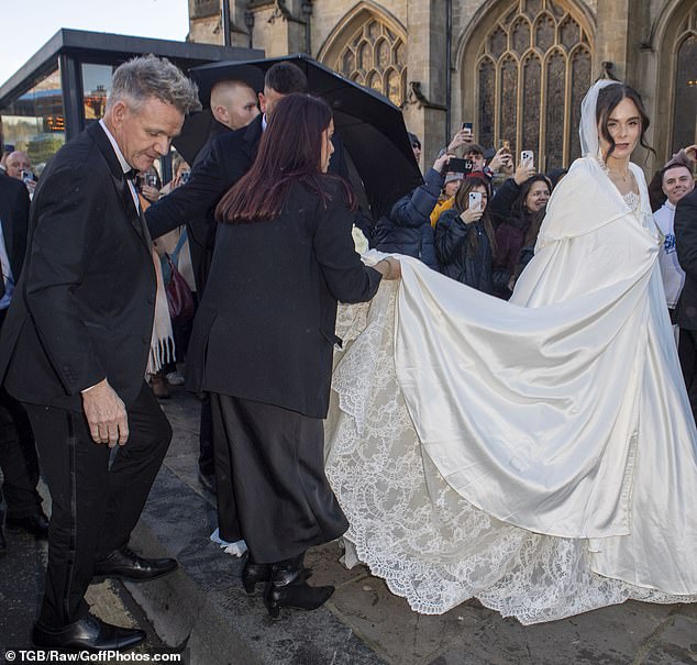 The billowing, shiny, white, hooded cloak that swamped her en route to the historic abbey must have felt like a fabulous idea for a winter wedding, yet lamentably it looked more Scottish Widows than luxury cover up