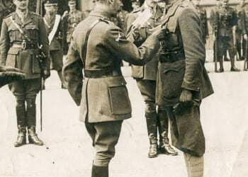 Captain Reginald Haine (pictured right) presented with the Victoria Cross by King George V at Buckingham Palace