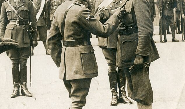 Captain Reginald Haine (pictured right) presented with the Victoria Cross by King George V at Buckingham Palace