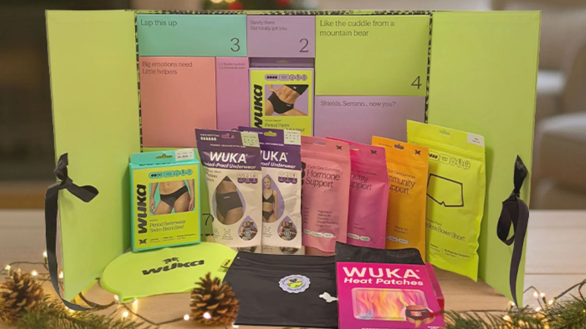 A period product advent calendar with WUKA period underwear, heat patches, and hormone support supplements.