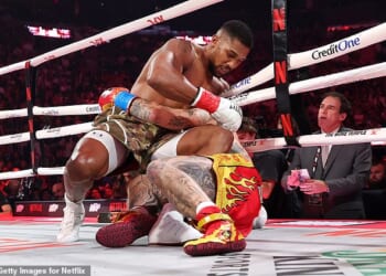 Anthony Joshua ends up on the canvas with Jake Paul - but went on to win the fight