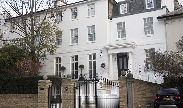 Pictured: The house before the electric fence was torn down from around the £44.5million mansion