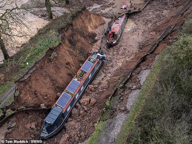 Pictures show the damage caused to the two narrowboats which were caught in the sinkhole