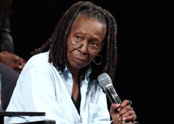 Whoopi Goldberg listens onstage at Storytellers alongside Rep. Jasmine Crockett in New York City on June 13, 2025.
