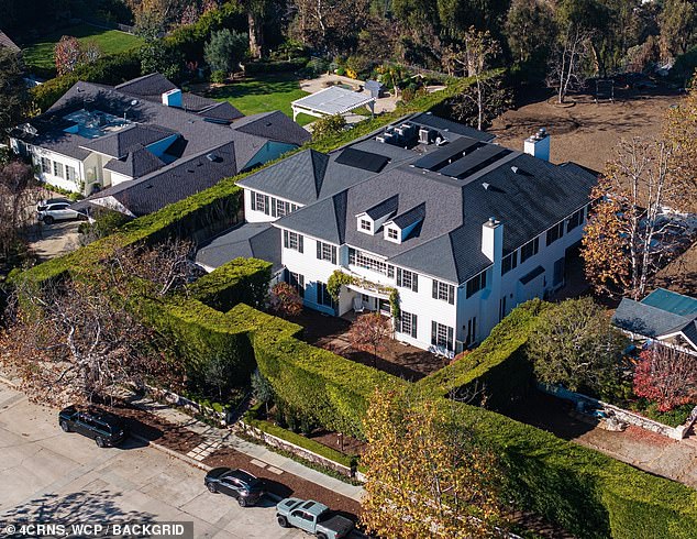 Multiple attendees have reported witnessing Rob, 78, and wife Michele, 70, having a heated argument with 32-year-old Nick at O'Brien's Los Angeles mansion (pictured) on Saturday night
